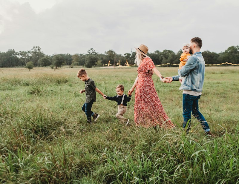 Happy family laughing together at home reviewing personal financial safeguards